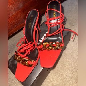 Fashion Nova Bold Red Heels with Gold Chain Accent